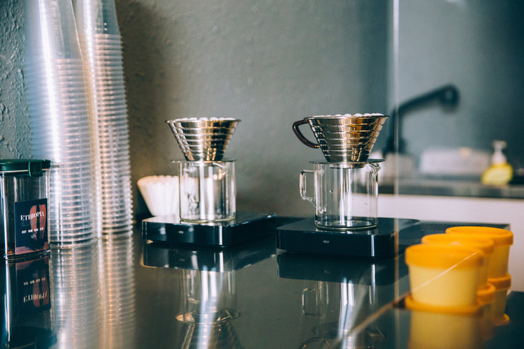 Brew-itCafe's setup for making luxury coffee with pour-over equipment and stylish glass servers
