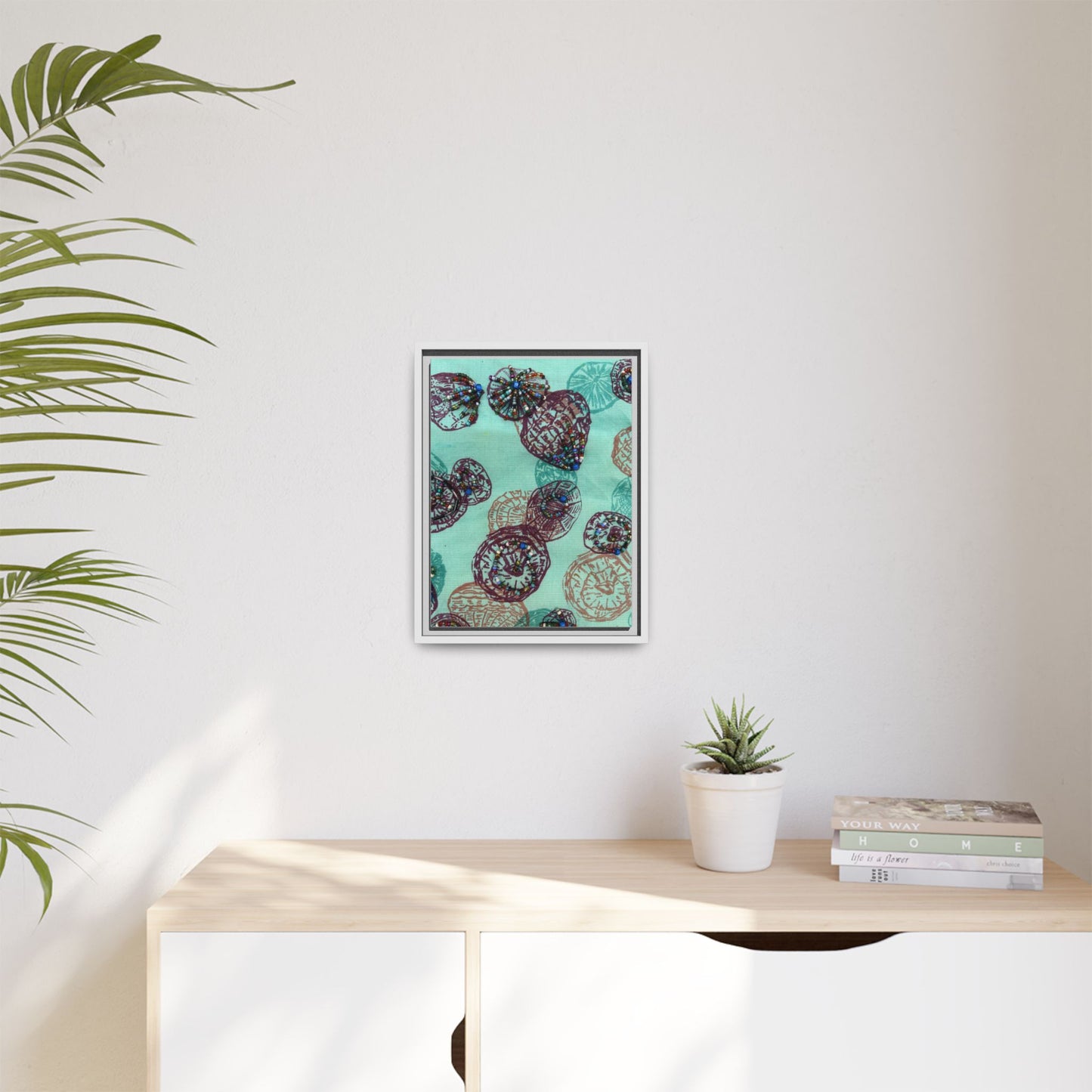 Framed abstract art for living room featuring colorful round shapes on a teal background