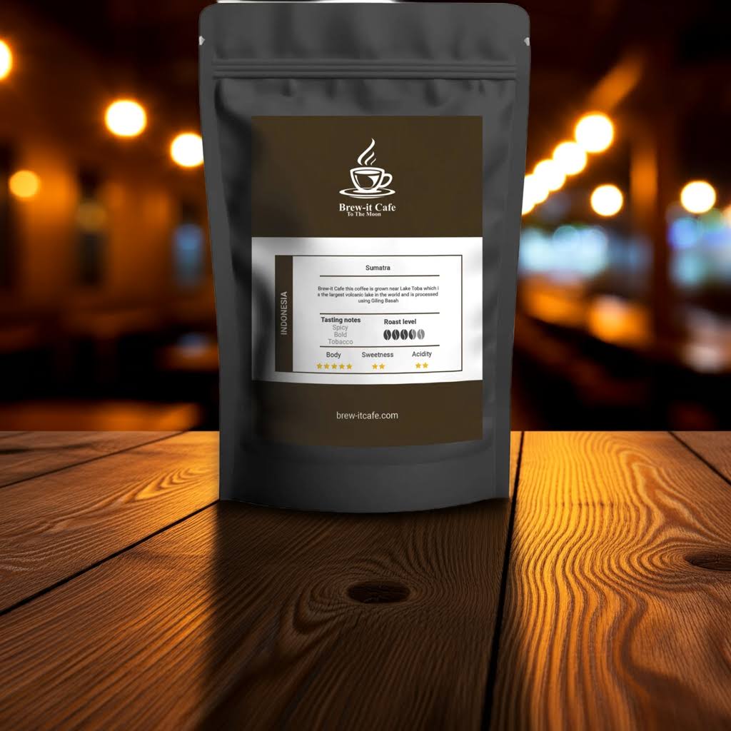 Indonesia Coffee - Sumatra Lake Toba in a black pouch displayed on a rustic wooden table with warm café lighting, emphasizing its specialty origin.