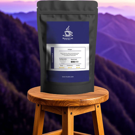 Guatemala Antigua Coffee Beans from Brew-itCafe on stool with scenic view, featuring bold flavor and smooth medium roast finish.