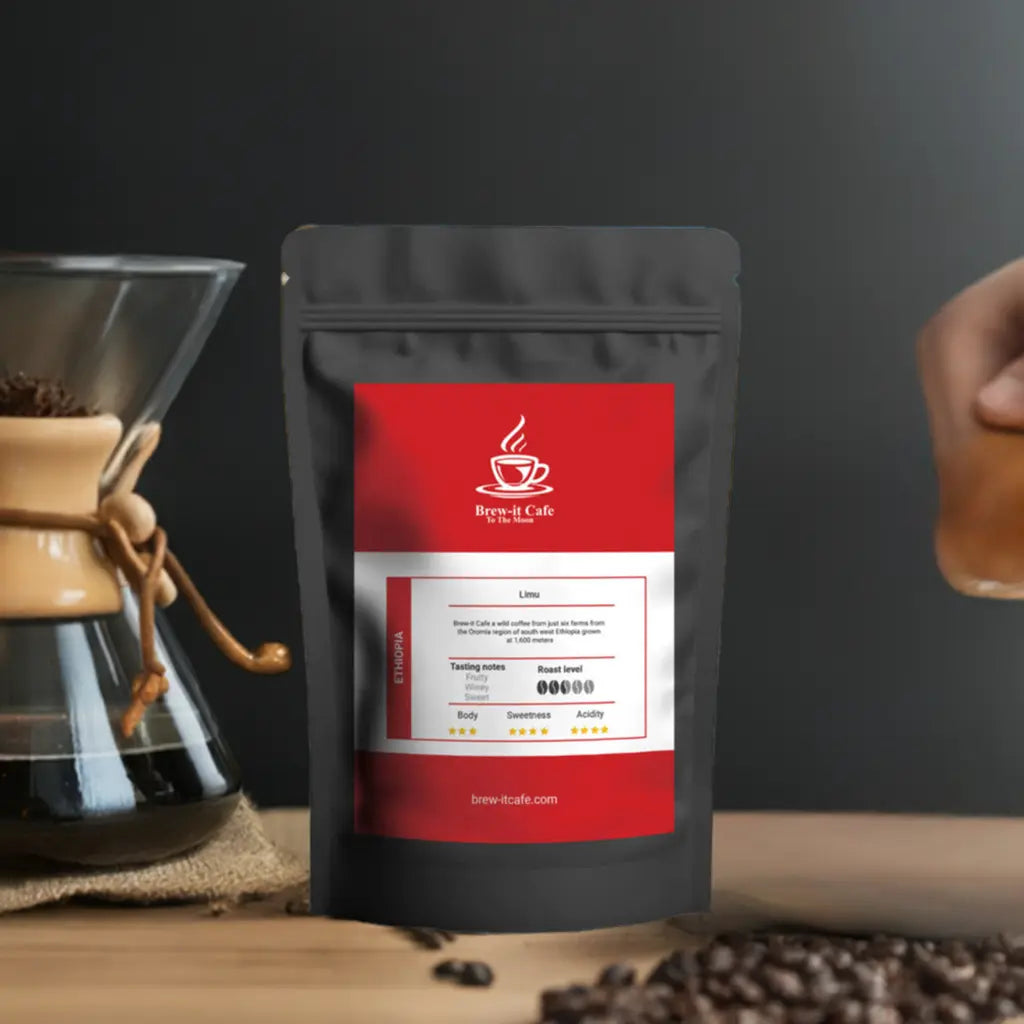 Brew-itCafe single-origin coffee bag with red label next to coffee brewer and beans on wooden surface