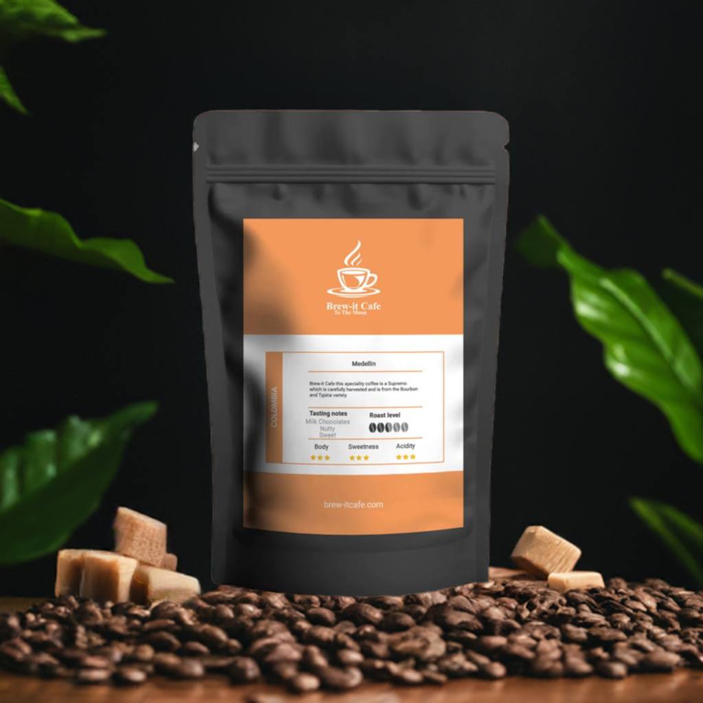 Brew-itCafe single-origin Medellin coffee bag surrounded by coffee beans and sugar cubes