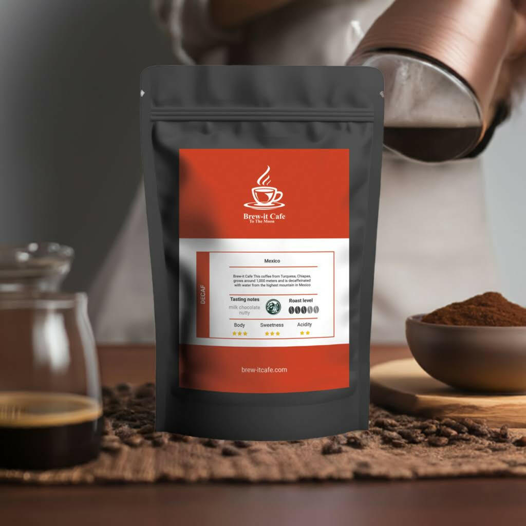 Brew-itCafe decaf coffee bag with tasting notes and roast level on a table with ground coffee and brewed cup