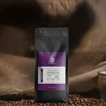 Brew-itCafe Espresso Roast in black packaging with purple label standing on coffee beans