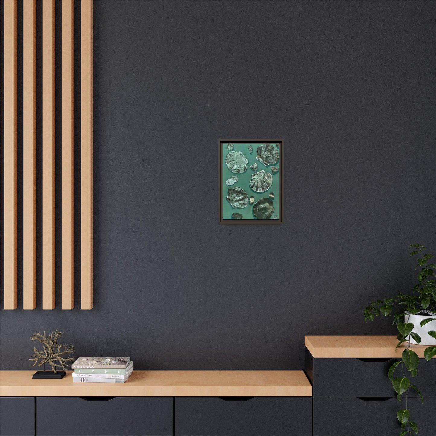 Framed canvas featuring multi-color seashell wall art displayed in a modern interior setting